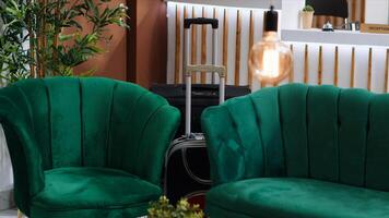 Classy lounge area with luxurious furniture at hotel resort, empty lobby entrance and front desk at reception. Beautiful elegant space creating comfortable vibe for guests and clients. photo