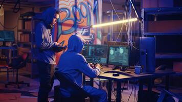 Spies in secret hideout trying to steal valuable data by hacking governmental websites but getting their attacks rejected by strong security, seeing access denied error message on screen photo