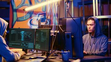 Hackers in underground hideaway utilizing technical knowhow of bugs and exploits to break into computer systems and access valuable data, bypassing firewalls and login process photo