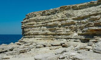Steep karst limestone shores and rocks in the Dzhangul tract, western Crimea, Tarkhankut photo