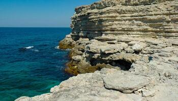 Steep karst limestone shores and rocks in the Dzhangul tract, western Crimea, Tarkhankut photo