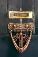 view of a traditional maltese door on old buildings with a hammer handle in Valletta on the island of Malta photo