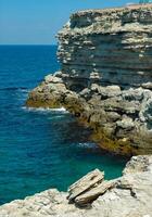 Steep karst limestone shores and rocks in the Dzhangul tract, western Crimea, Tarkhankut photo