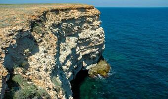 Steep karst limestone shores and rocks in the Dzhangul tract, western Crimea, Tarkhankut photo