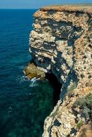 Steep karst limestone shores and rocks in the Dzhangul tract, western Crimea, Tarkhankut photo