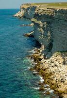 Steep karst limestone shores and rocks in the Dzhangul tract, western Crimea, Tarkhankut photo