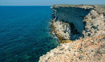 Steep karst limestone shores and rocks in the Dzhangul tract, western Crimea, Tarkhankut photo