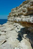 Steep karst limestone shores and rocks in the Dzhangul tract, western Crimea, Tarkhankut photo