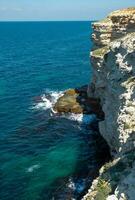 Steep karst limestone shores and rocks in the Dzhangul tract, western Crimea, Tarkhankut photo