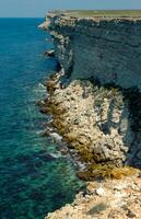 Steep karst limestone shores and rocks in the Dzhangul tract, western Crimea, Tarkhankut photo