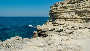 Steep karst limestone shores and rocks in the Dzhangul tract, western Crimea, Tarkhankut photo