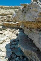 Steep karst limestone shores and rocks in the Dzhangul tract, western Crimea, Tarkhankut photo