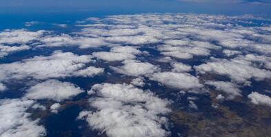 White clouds from the window of the aircraft, Malta under the wing of the aircraft photo