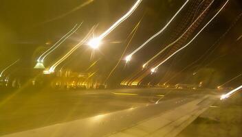 Blurred frame, abstract movement of light from lighting lanterns at the airfield, Egypt photo