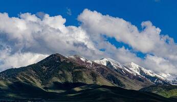 Rain clouds during the day over mountains in the state, US photo