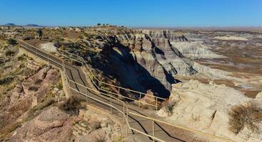 The Painted Desert on a sunny day. Diverse sedimentary rocks and clay washed out by water. Petrified Forest National Park, USA, Arizona photo