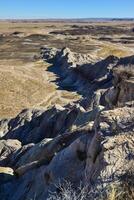 The Painted Desert on a sunny day. Diverse sedimentary rocks and clay washed out by water. Petrified Forest National Park, USA, Arizona photo