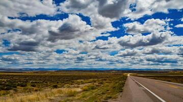 Rain clouds during the day over the plains in Utah, US photo