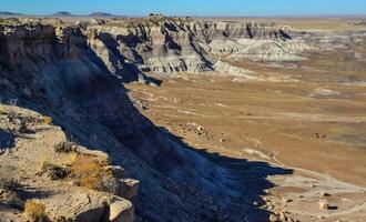 The Painted Desert on a sunny day. Diverse sedimentary rocks and clay washed out by water. Petrified Forest National Park, USA, Arizona photo