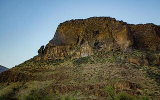Mountain formations from vertical columnar lava formations, USA photo