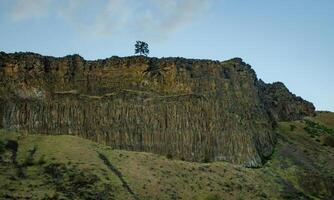 Mountain formations from vertical columnar lava formations, USA photo