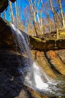 A small waterfall in the autumn in the forest in the parkon Brandywine Creek in Cuyahoga Valley National Park, Ohio. photo
