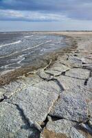 The shore of a hyperhaline lake covered with self-precipitating salt Sodium chloride, California photo