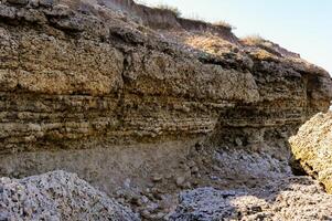 Layered shell-shore, destroyed by waves during storms, Black Sea photo