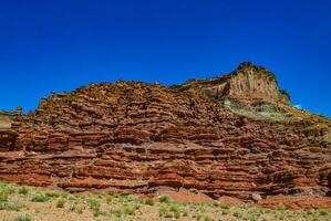 Layered geological formations of red rocks in Canyonlands National Park is in Utah near Moab. photo