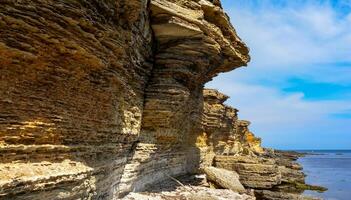 Collapsing layered shell rock coastline of Pontian limestones in the western Crimea, Black Sea photo