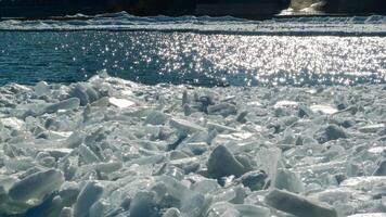 Frozen Black Sea, blocks of melting ice on the seashore photo