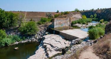 Concrete hydraulic structures on a small river connecting the lake and the river, Ukraine photo
