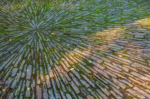 Radial pattern of natural stones, photo in the park in Nantes