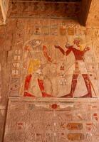 EGYPT, LUXOR - MARCH 01, 2019 archaeological site, drawings and geoglyphs on the walls of an ancient temple, the temple of Hatshepsut near Luxor in Egypt photo