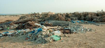 Plastic bottles and various garbage from hotels in the wild, Garbage dump in the desert in Egypt photo