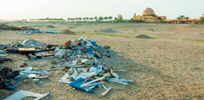 Plastic bottles and various garbage from hotels in the wild, Garbage dump in the desert in Egypt photo