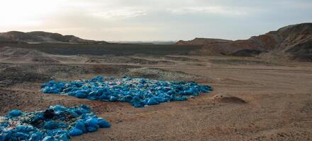 Plastic bottles and various garbage from hotels in the wild, Garbage dump in the desert in Egypt photo