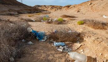 Plastic bottles and various garbage from hotels in the wild, Garbage dump in the desert in Egypt photo