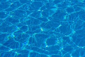 The reflection of the suns rays in the water in the pool with sea water, The glare of the sun, Egypt photo
