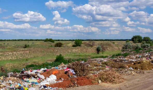 Pollution of nature, spontaneous garbage dump in the field, environmental problem of Ukraine photo