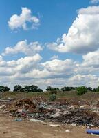 Pollution of nature, spontaneous garbage dump in the field, environmental problem of Ukraine photo