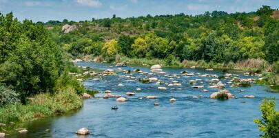 A fisherman in a rubber boat catches fish behind rock rifts in the middle photo