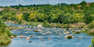 A fisherman in a rubber boat catches fish behind rock rifts in the middle photo