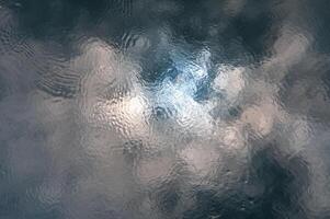 Reflection of clouds and sun in water in the Southern Bug River photo