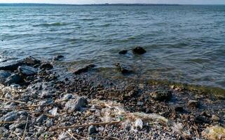 Plastic garbage and microplastics on the shore of Khadzhibey Estuary photo