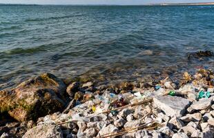 Plastic garbage and microplastics on the shore of Khadzhibey Estuary photo