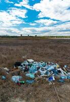Heaps of garbage on the bank of the Kuyalnik estuary photo