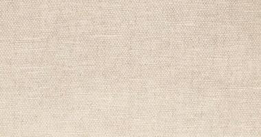 Natural Linen Material Textile Canvas Fabric Texture Background Close-up Detail of Fabric Natural Color Hemp Material Pattern Design Wallpaper. Can be Used as Background or For Graphic Design photo