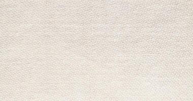 Natural Linen Material Textile Canvas Fabric Texture Background Close-up Detail of Fabric Natural Color Hemp Material Pattern Design Wallpaper. Can be Used as Background or For Graphic Design photo