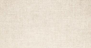 Natural Linen Material Textile Canvas Fabric Texture Background Close-up Detail of Fabric Natural Color Hemp Material Pattern Design Wallpaper. Can be Used as Background or For Graphic Design photo